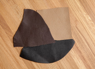 leather samples on wooden background