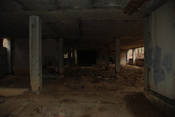 Fototapeta na wymiar Dark basement of abandoned decay building, urbex