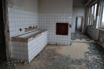 Urbex, ruins of bathroom in abandoned barracks  