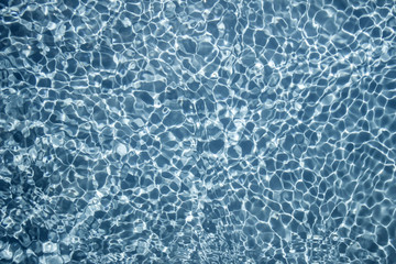 Crystal clear blue water in swimming pool