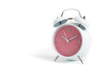 Narrow focus to clock with time 10 past 12 or 10.00 AM PM, pink clock face, on white background