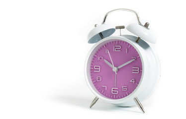 Narrow focus to clock with time 10 past 12 or 10.00 AM PM, violet clock face, on white background