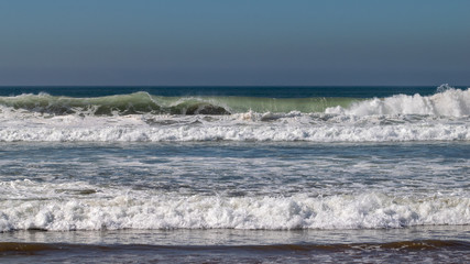 Atlantic Ocean waves breaking on sand beach in Agadir, Morocco, Africa