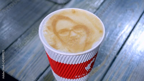 Drawing Of A Woman's Face On A Foam Coffee Latte In A Glass Created By A 3D  Printer Close Up 3d Printer Created A Portrait Of A Girl On The Foam Of