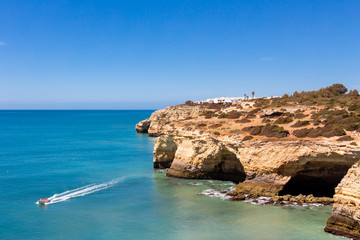 Beautiful view over cliffs and turquoise ocean in Benagil beach (Praia de Benagil), Algarve, Portugal