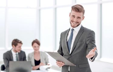 friendly businessman inviting to his office