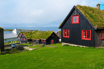 Fototapeta na wymiar Traditional Faroese wooden houses in Kirkjubour Village