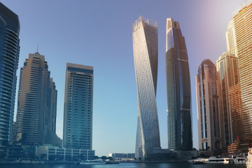 Obraz na płótnie Canvas Dubai marina, United Arab Emirates. Sunrise over modern city skyline.