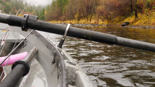 Close oar paddle on a drift boat fishing a river. 