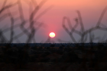 beautiful sunset with red sun in Namibia