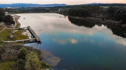 Aerial view of lake surrounded by forest. Sumarice lake in Kragujevac - Serbia