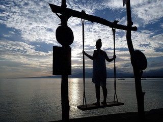 swing with girl on the beach at sunrise - Gili Air - Bali