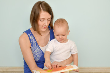 mom and baby reading a book