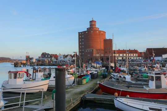 picturesque fishing boats and the round silo plant at the romantic harbor of Eckernförde