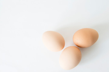 Three Eggs on the white table, three easter eggs