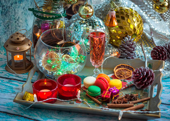 Christmas still life with glass of wine and macaroons