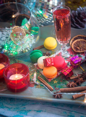 Obraz na płótnie Canvas Christmas still life with glass of wine and macaroons