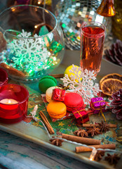 Christmas still life with glass of wine and macaroons