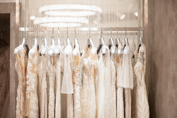 Elegant dresses in the wedding salon. The choice of wedding dresses in the store