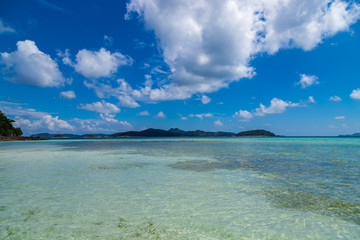 Tropical background view from Malcapuya island to nearest islands. Travel vacation at Philippines.