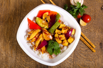 Wok with rice, cheese and tofu