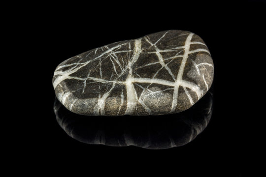 Colorful stone with different designs and colors and black background