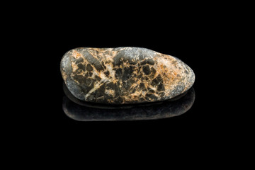 Colorful stone with different designs and colors and black background