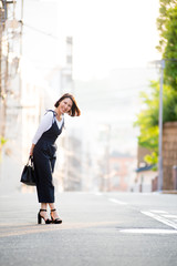 Japanese female model posing for the pictures on the street of Tokyo, Japan. Many artists are living in Tokyo to improve their works of art.