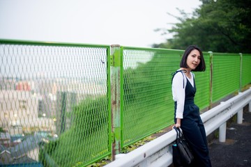 Japanese female model posing for the pictures on the street of Tokyo, Japan. Many artists are living in Tokyo to improve their works of art.