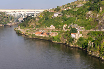 Fototapeta na wymiar View of Porto in Portugal. Douro floating in valley.