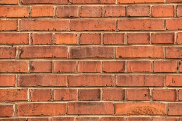 Old empty brick house factory wall with red bricks