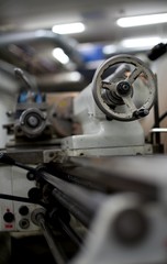 Obraz na płótnie Canvas Lathe machine for metal cutting, machinery center background.