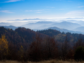 Fototapeta na wymiar Beskids Mountains in Autumn from Jaworzyna Range nearby Piwniczna-Zdroj town, Poland. View to the south.