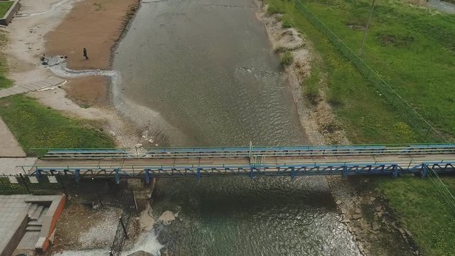 Aerial view of the wooden bridge over the river