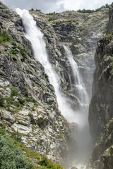 Waterfall in nature. Georgia/ Mestia. Travel concept photo.