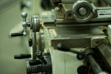 Fototapeta na wymiar Lathe machine for metal cutting, machinery center background.