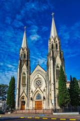 Fototapeta na wymiar Cathedral church of Botucatu under blue sky with clouds at dawn