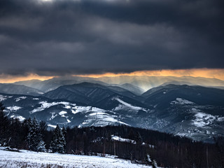Heavy Clouds in Beskids Mountains in winter. Near Rytro Village, view from Mount Makowica. Poland.