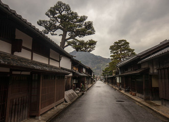 Quiet street lined with traditional Japanese wooden buildings