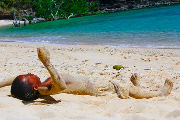 Poor malagasy boy playing on the beach
