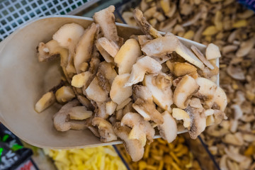 frozen mushrooms, champignons on a spatula