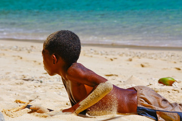 Poor malagasy boy playing on the beach © dr322