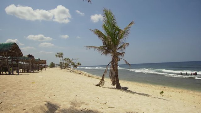 Tropical island with white sandy beach in blue lagoon, palm tree. Patarl white sand beach with turquoise water. Seascape, ocean and beautiful beach. Philippines, Anda, Pangasinan. Travel concept.