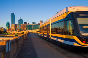 Moving streetcar on the Houston Street Viaduct with the city of Dallas in background. The Dallas Streetcar is a 2.tif