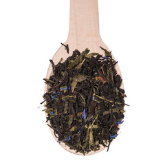 Mix of black tea with green sencha tea and cornflower flowers and strawberry slices on white background