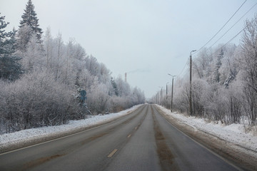 Fototapeta premium Landscape with the image of a winter road