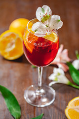 Aperol spritz cocktail decorated with flower. Close up