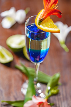 Fresh Cocktail With Blue Curacao Liqueur On Wooden Table. Close Up