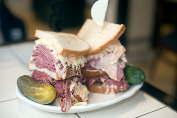 Kosher deli combination sandwich pastrami corned beef tongue cole slaw and Russian dressing