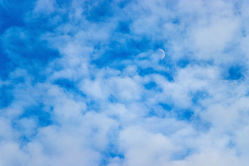 Clouds, blue sky and moon